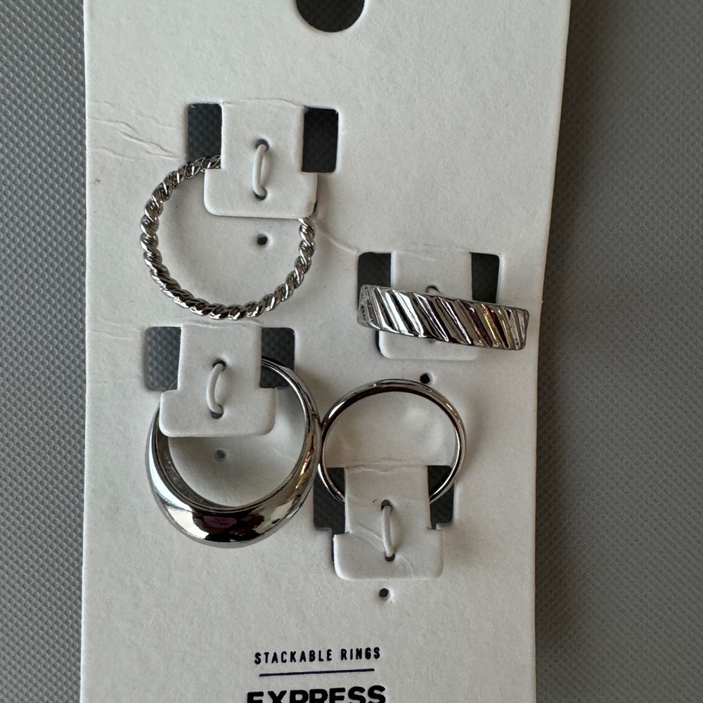 4 stackable silver rings from Express Size 8